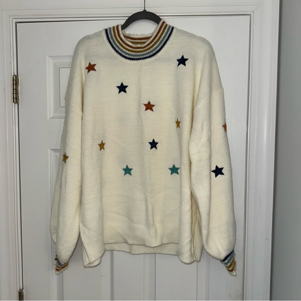 White sweater with stars